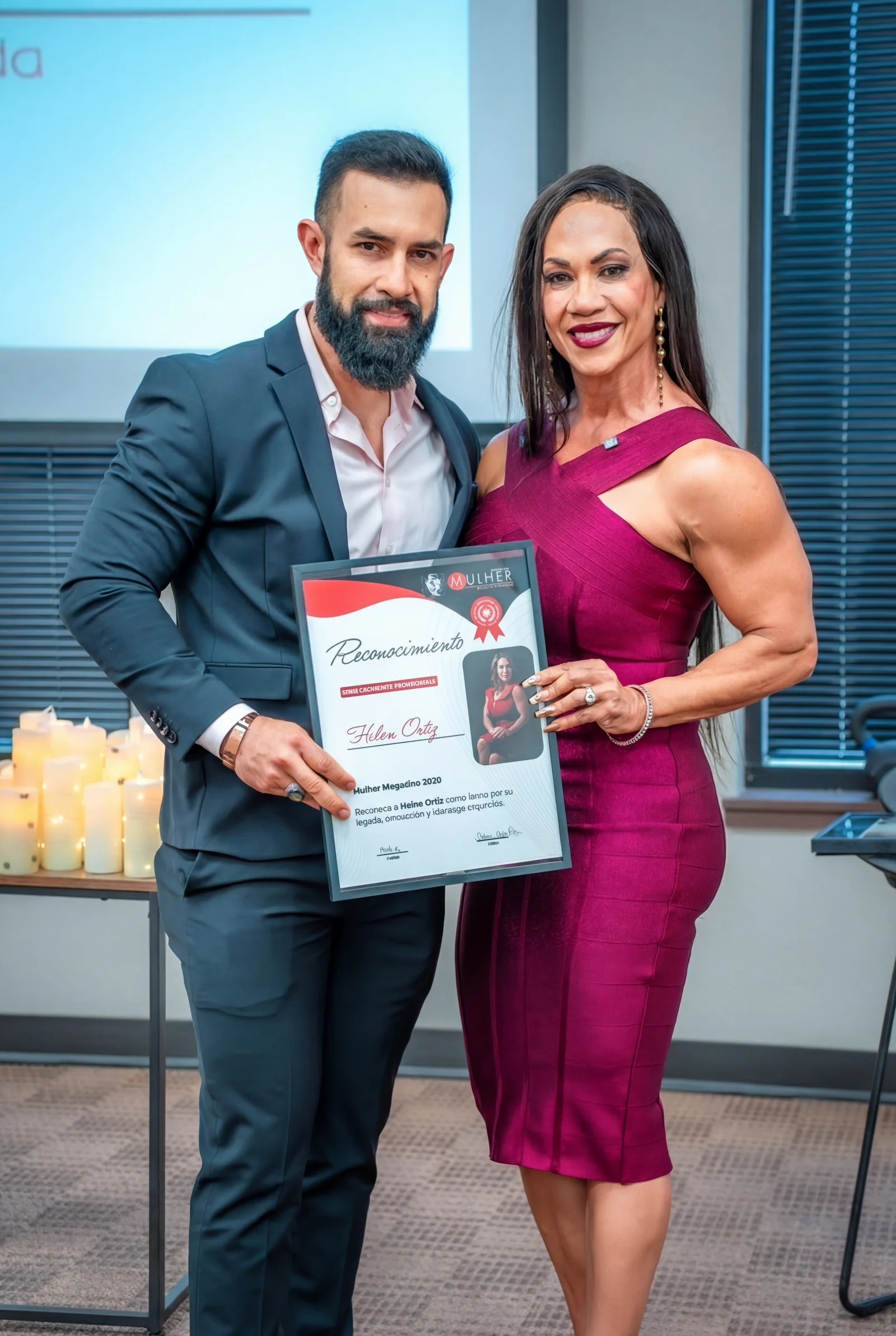 Kansas City business photography capturing award ceremony with couple holding certificate