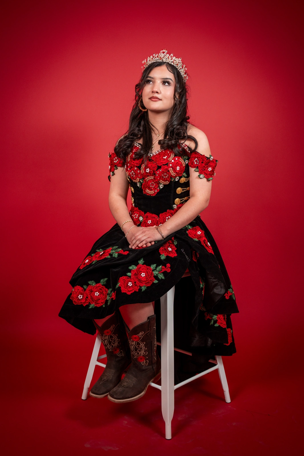 Kansas City quinceañera studio portrait looking up in black and red dress