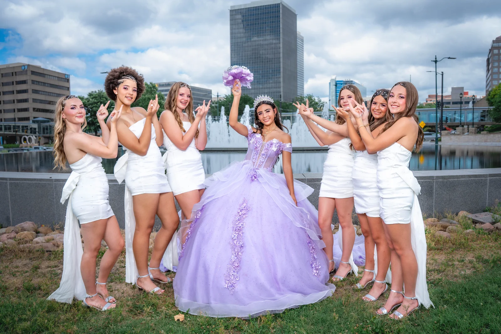 Quinceañera group photo in Kansas City with court wearing white dresses by Union Station