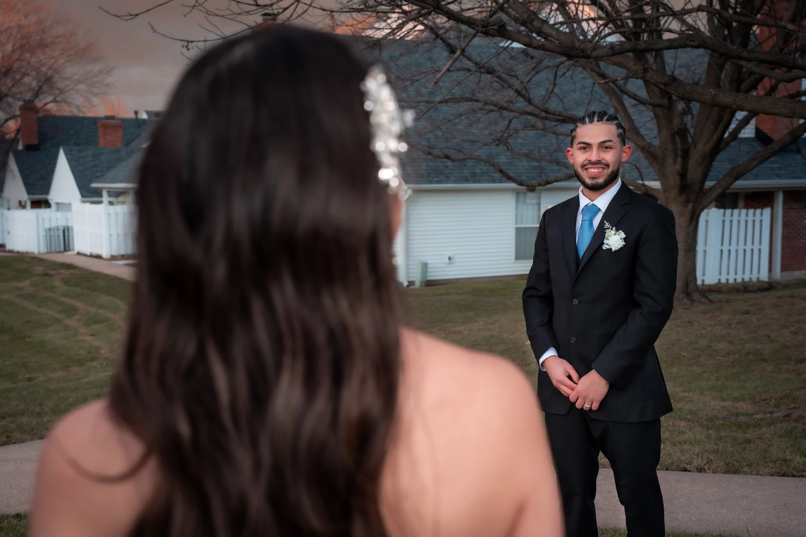 Groom smiling during first look moment as bride approaches in Kansas City wedding session