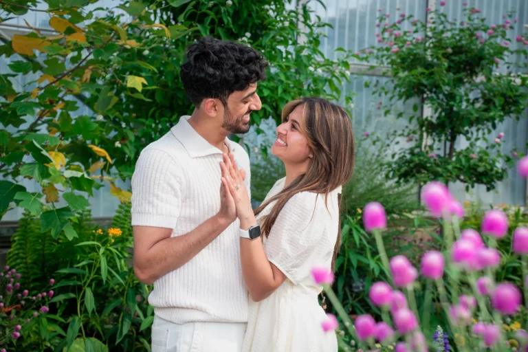 indian couple getting engaged out by the flowers